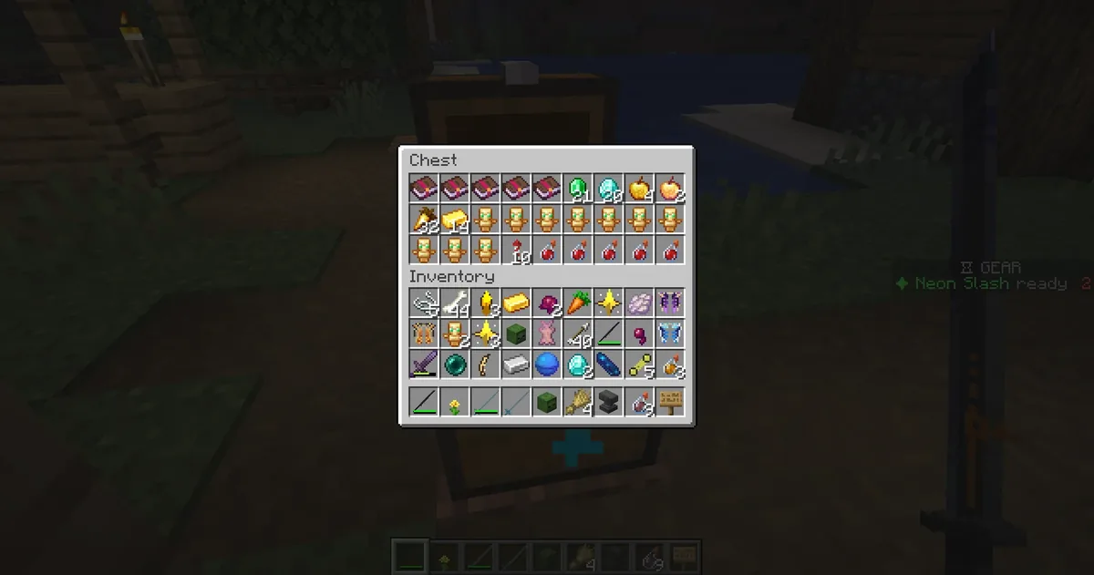 A loot chest back in the real world surrounded by celebration particles, plus a personal drop notification listing an Enchantment Stone and a Gear Core
